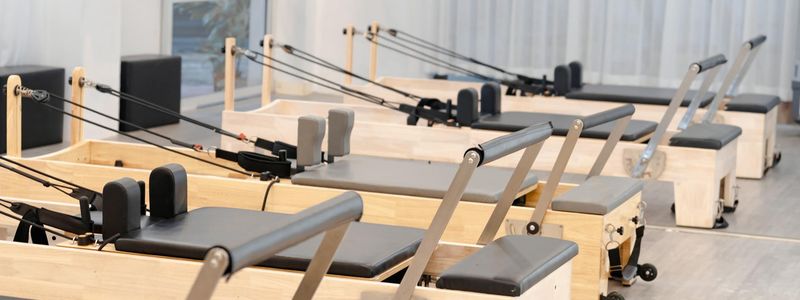 Wide view of an empty, minimalist studio space for exercise.